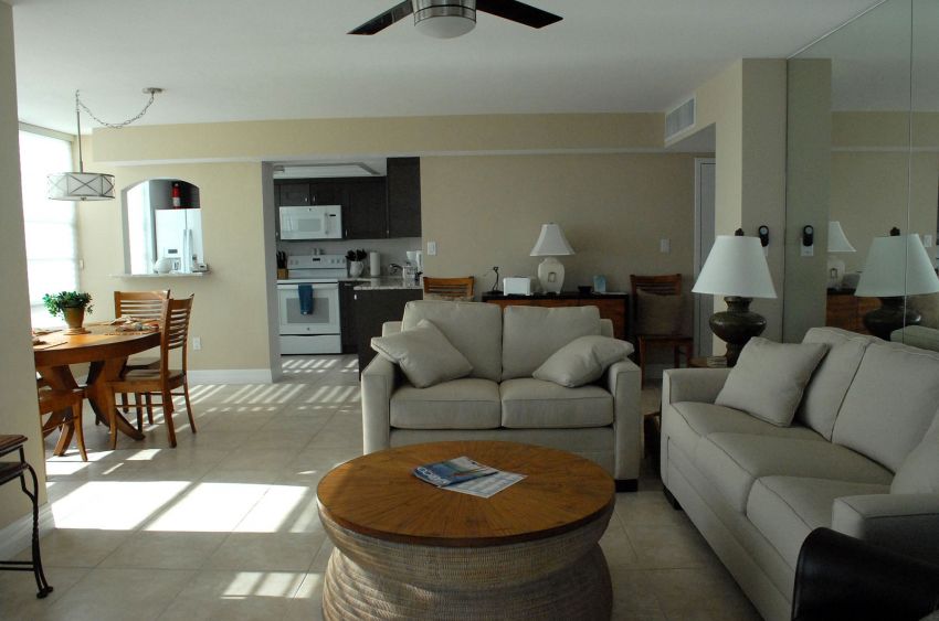 Living room showing dining area and kitchen entrance